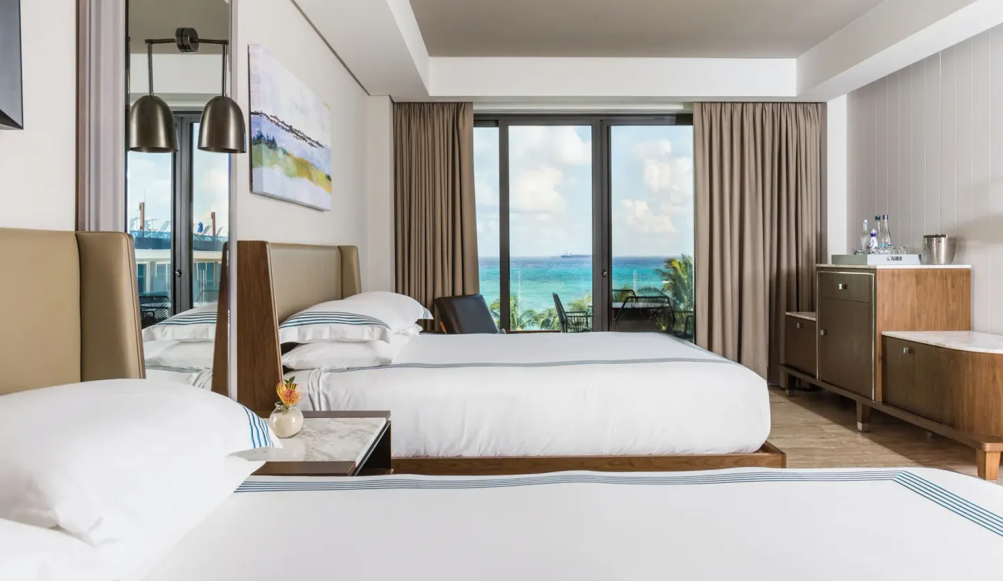 Two-bed guest room with ocean-facing balcony at Hyatt Centric Playa del Carmen - Downtown House & Beach House.
