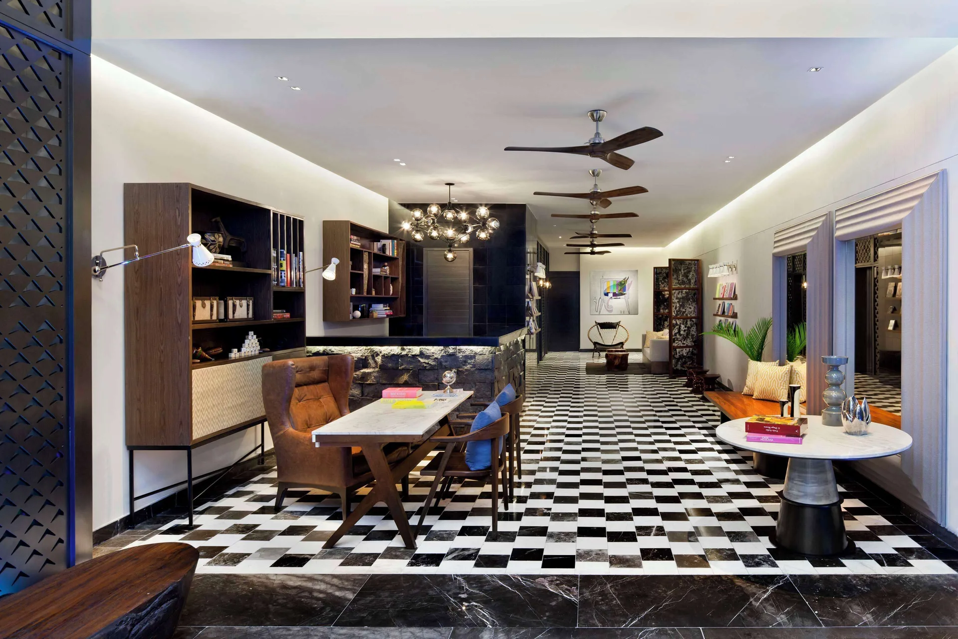 Library-style lobby lounge at Hyatt Centric Playa del Carmen - Downtown House & Beach House.