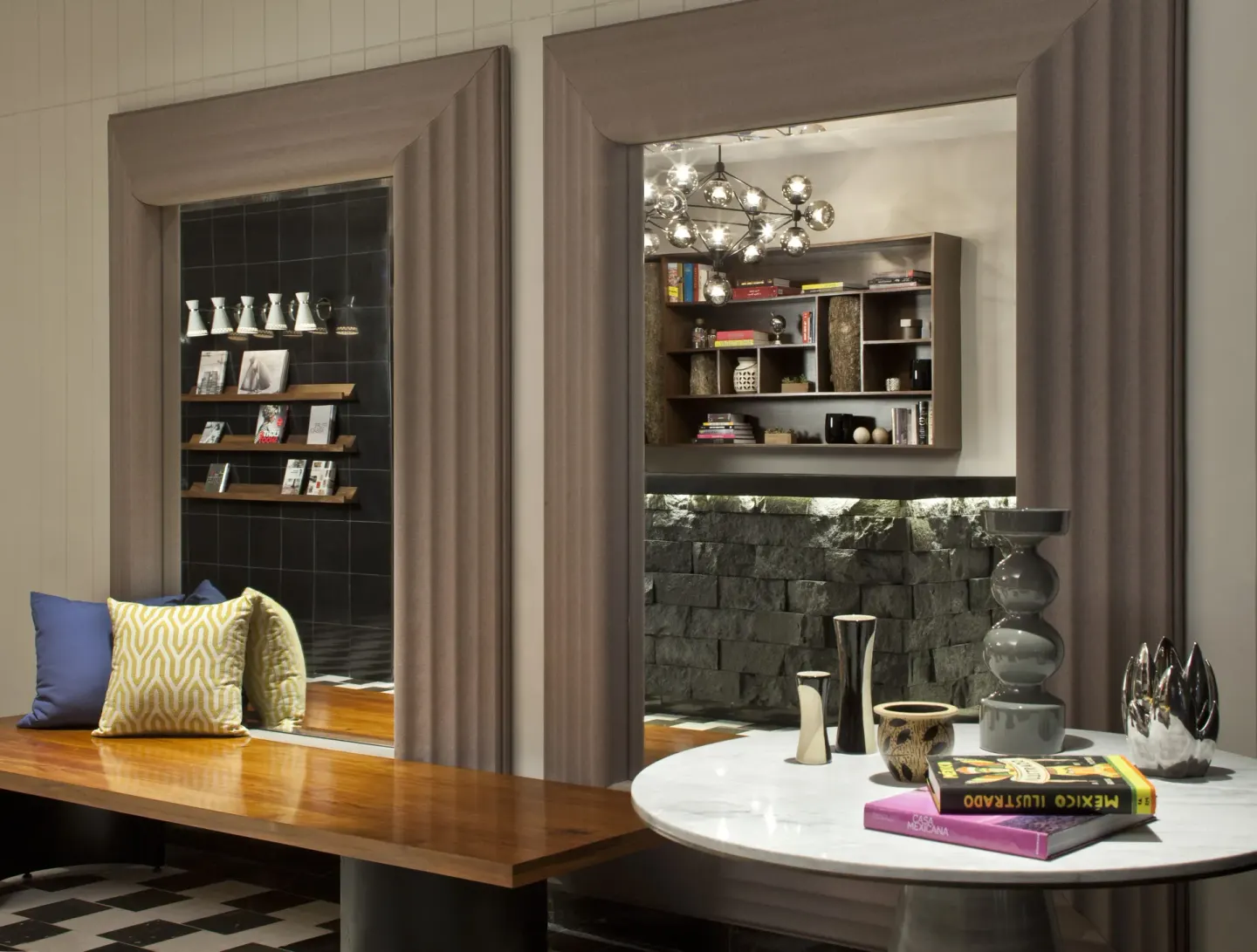 Lobby lounge shelves and seating at Hyatt Centric Playa del Carmen - Downtown House & Beach House.
