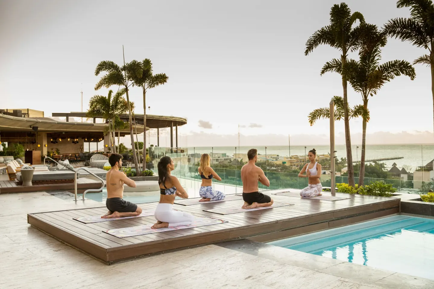 Pool deck yoga class at Hyatt Centric Playa del Carmen - Downtown House & Beach House.