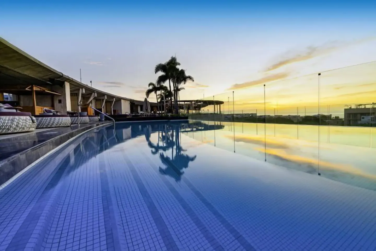 Rooftop infinity pool at sunset at Hyatt Centric Playa del Carmen - Downtown House & Beach House.