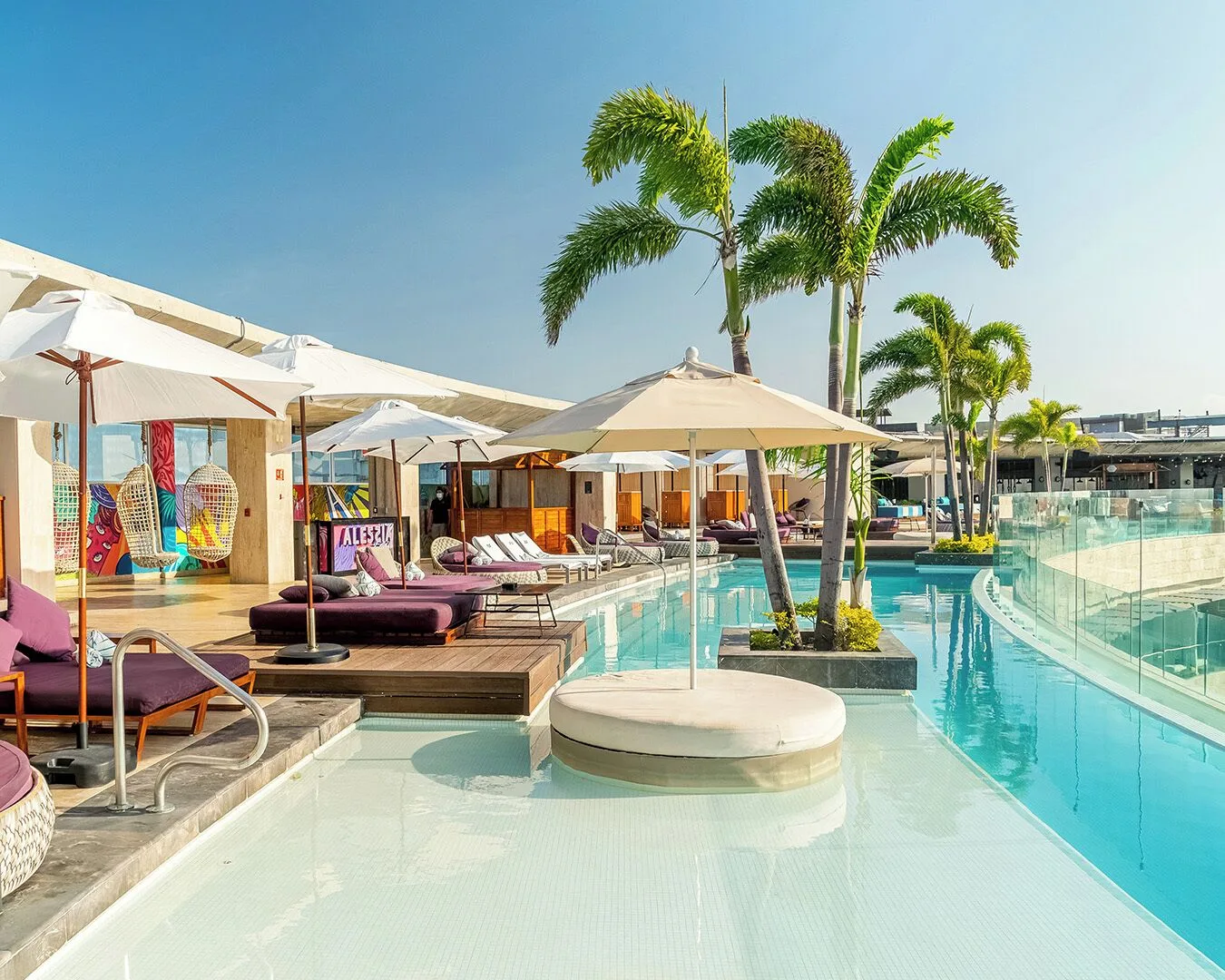 Rooftop pool with palms and loungers at Hyatt Centric Playa del Carmen - Downtown House & Beach House.