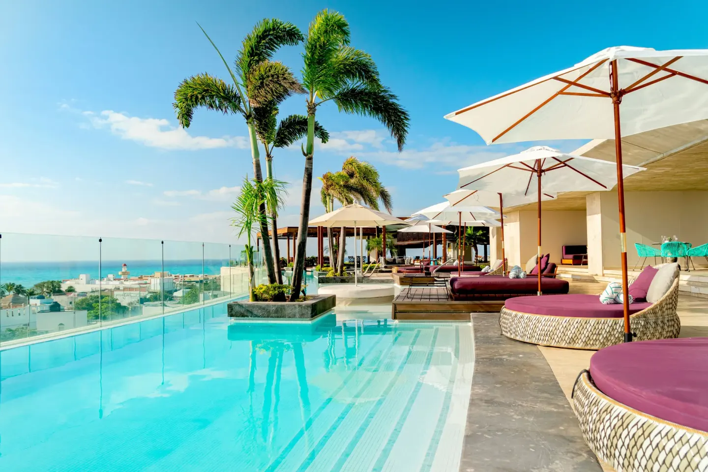 Rooftop pool with daybeds and ocean view at Hyatt Centric Playa del Carmen - Downtown House & Beach House.