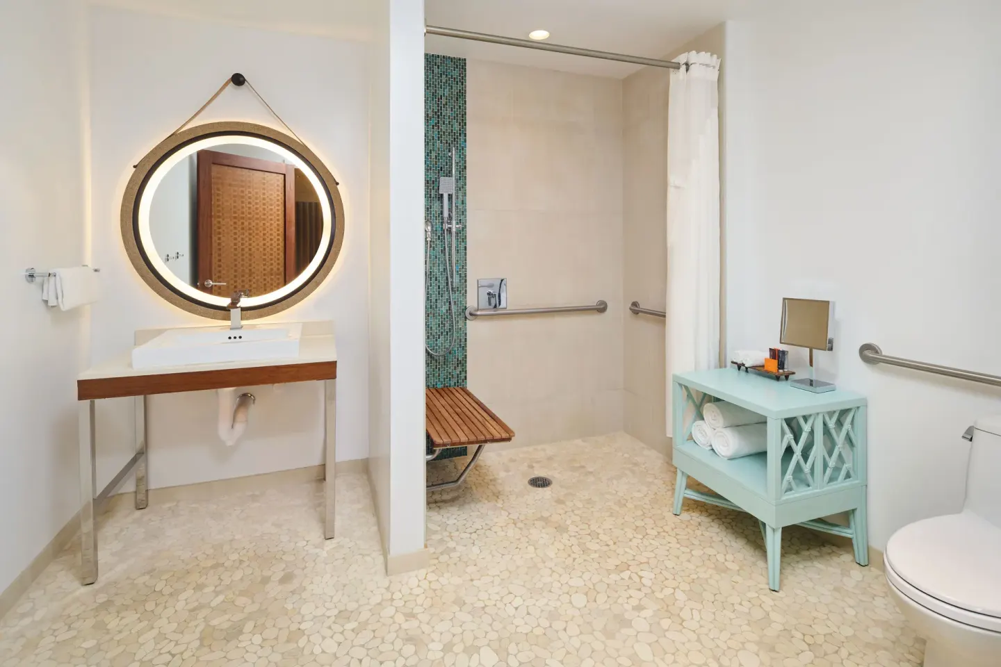 Accessible bathroom with roll-in shower and vanity at Hyatt Centric Waikiki Beach.