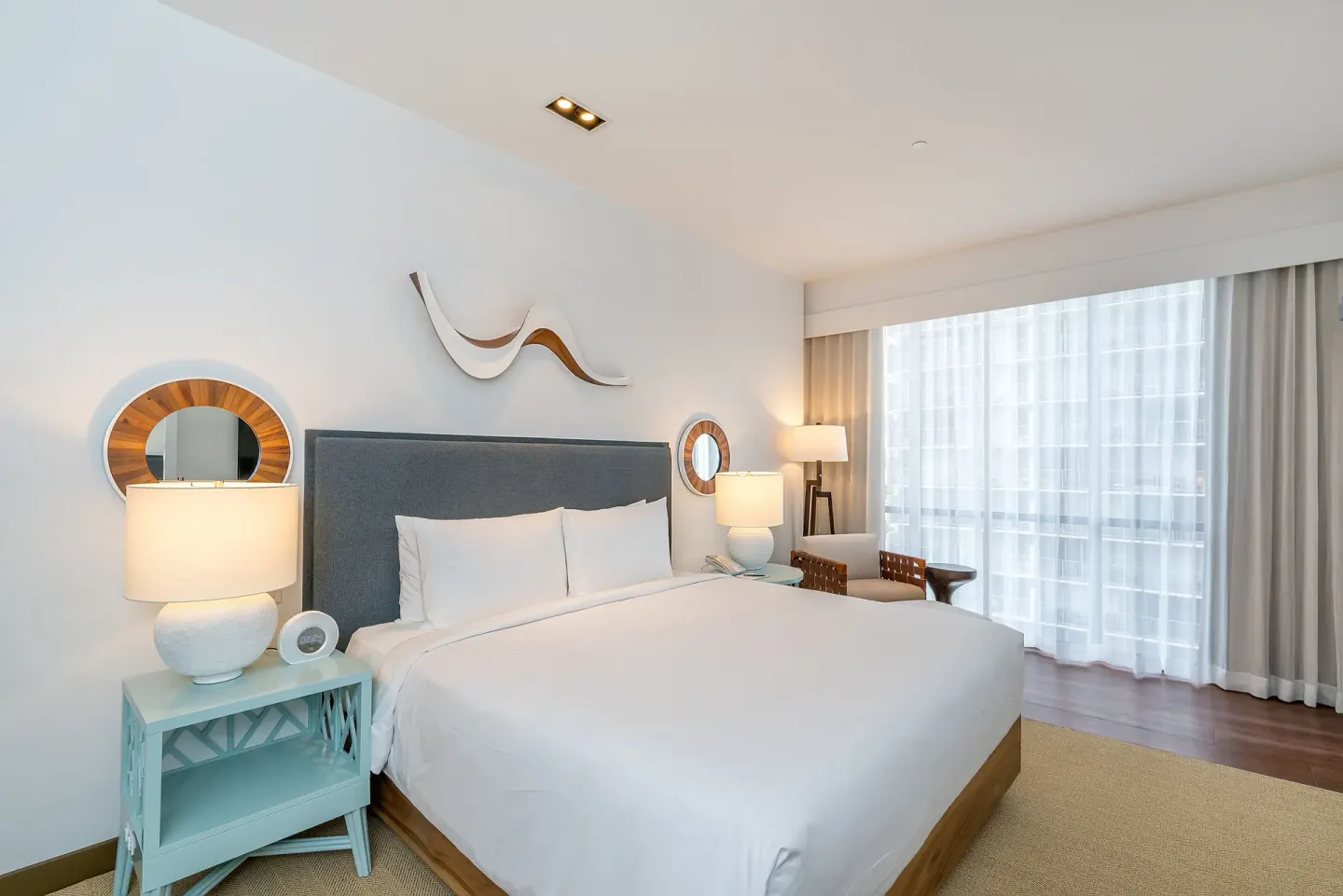 High-floor king guest room with window seating at Hyatt Centric Waikiki Beach.