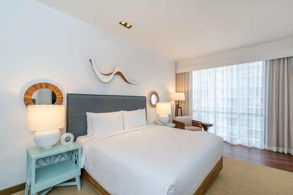 High-floor king guest room with window seating at Hyatt Centric Waikiki Beach.