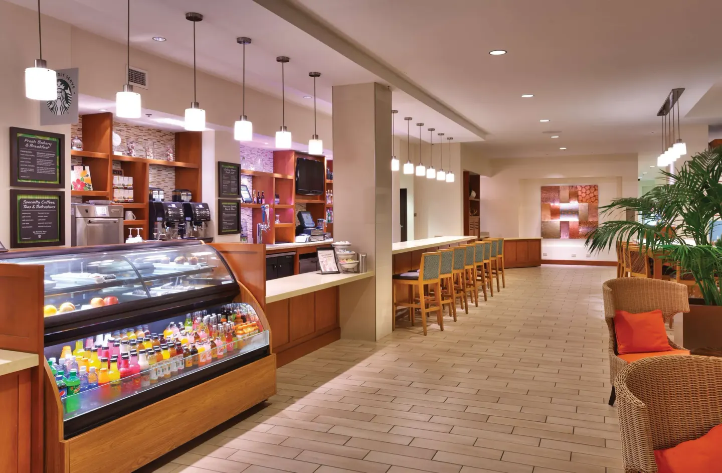 Grab-and-go cafe counter with drinks and snacks at Hyatt Place Waikiki Beach.