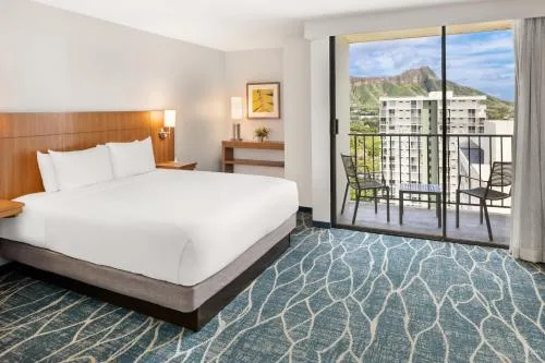 Specialty Mountain View bed and balcony seating at Hyatt Place Waikiki Beach.