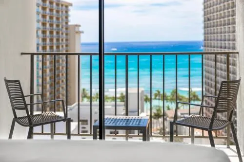 Specialty Ocean View room balcony with chairs at Hyatt Place Waikiki Beach.