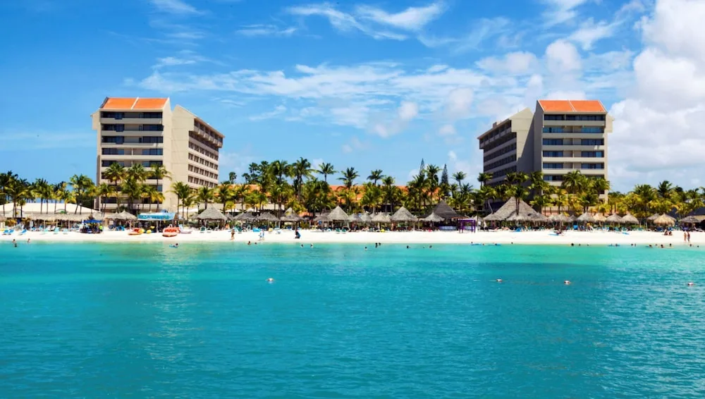 Barceló Aruba all-inclusive resort on Palm Beach with beachfront pools and modern architecture.