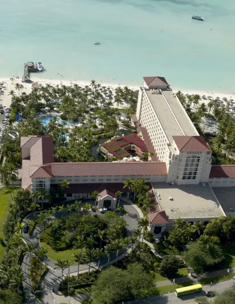 Aerial view of the beachfront resort and pools at Hyatt Regency Aruba Resort and Casino.