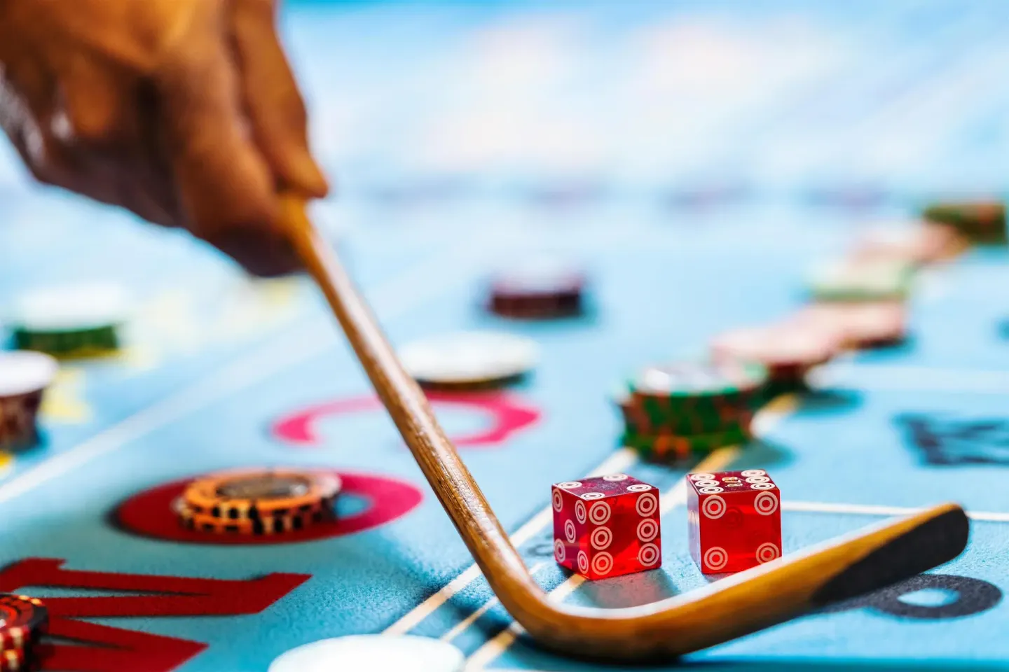 Close-up of casino dice and chips on a gaming table at Hyatt Regency Aruba Resort and Casino.