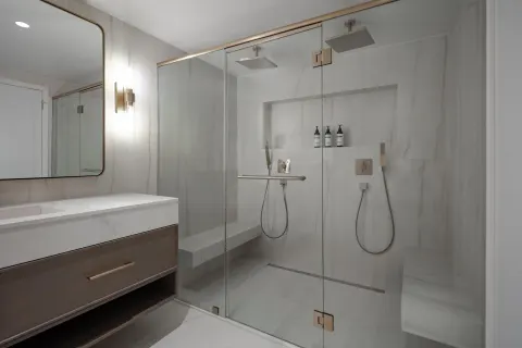 Modern bathroom with glass shower at Hyatt Regency Aruba Resort and Casino.