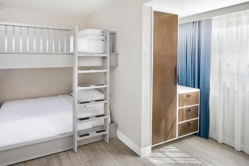 Family Suite bunk bed nook with wardrobe at Hyatt Regency Aruba Resort and Casino.