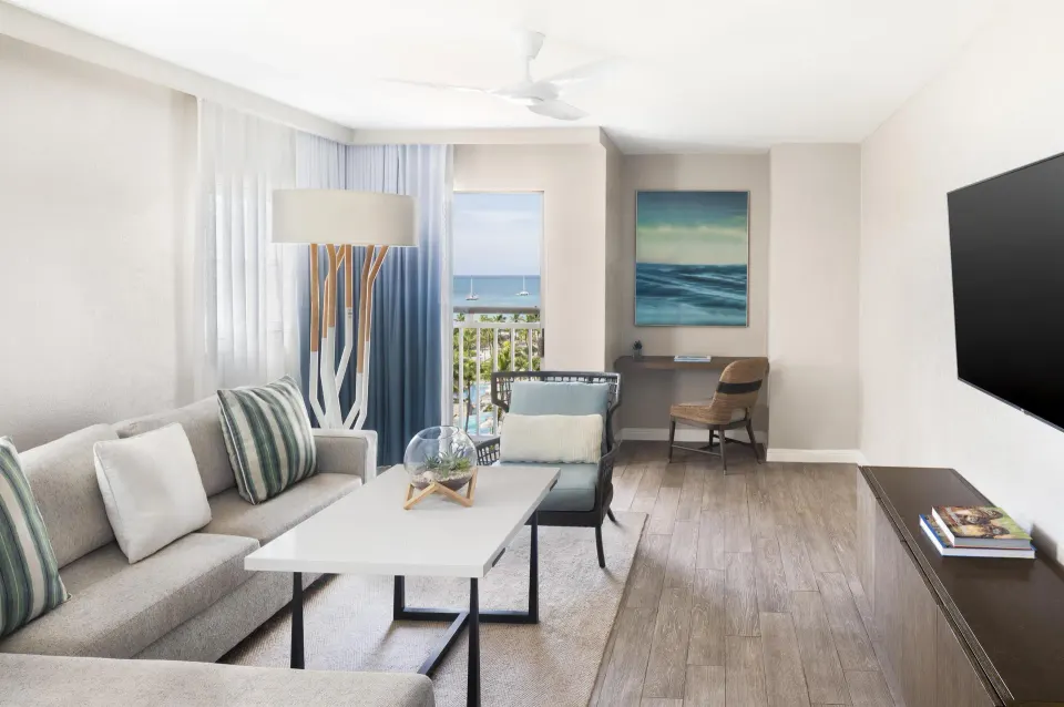 Family Suite living area with sofa and ocean view at Hyatt Regency Aruba Resort and Casino.