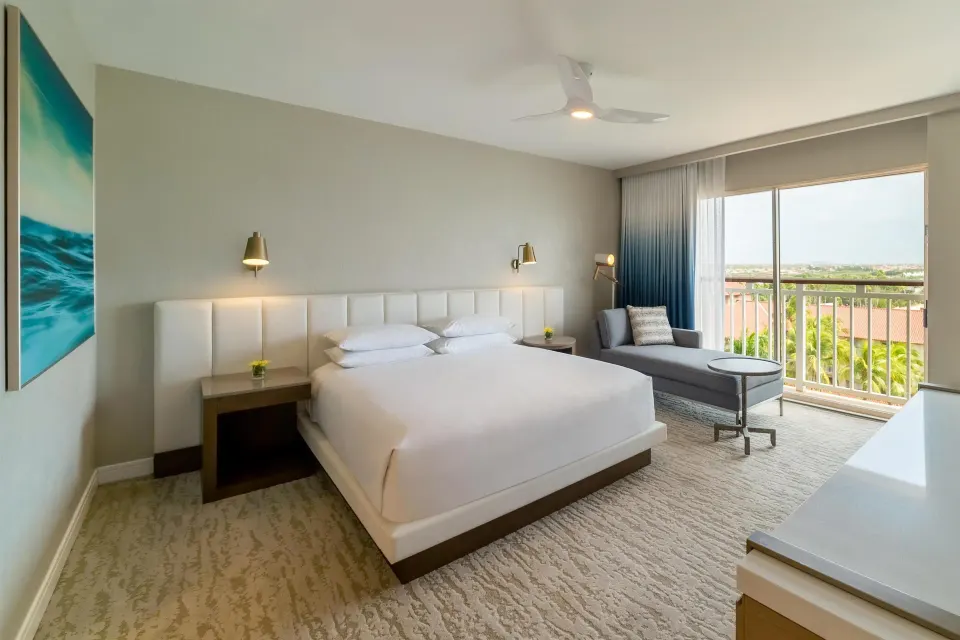 King resort view room with balcony seating at Hyatt Regency Aruba Resort and Casino.