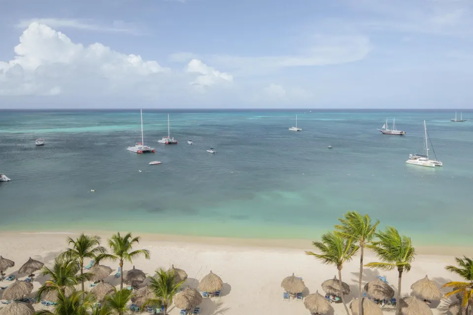 Daytime beach and ocean view from a room at Hyatt Regency Aruba Resort and Casino.