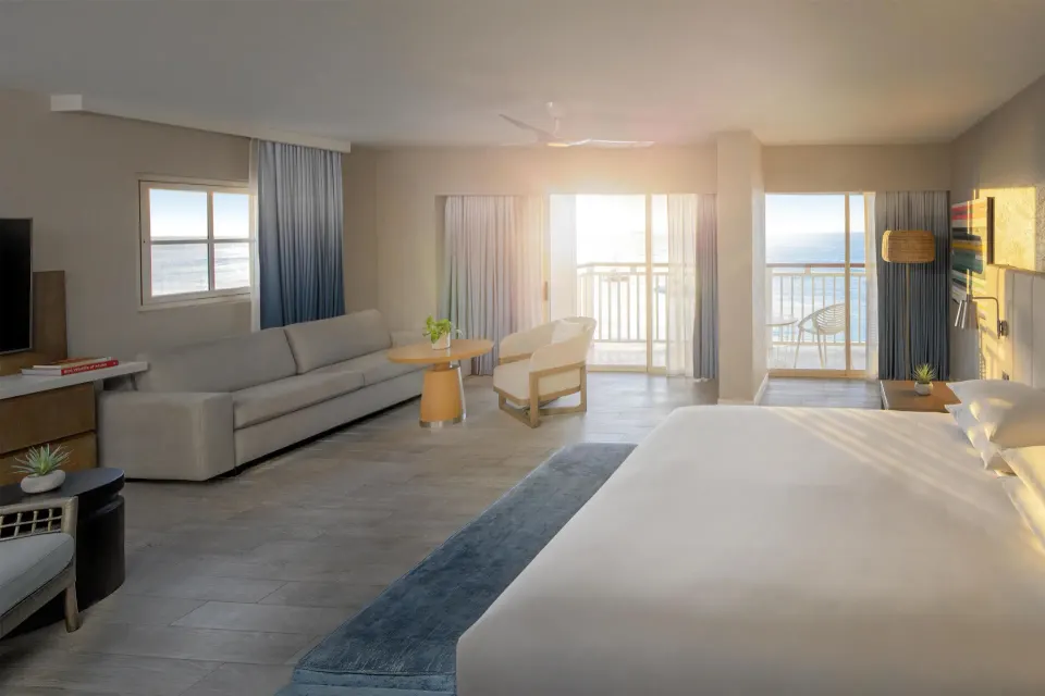 Oceanfront studio with king bed and balcony at Hyatt Regency Aruba Resort and Casino.