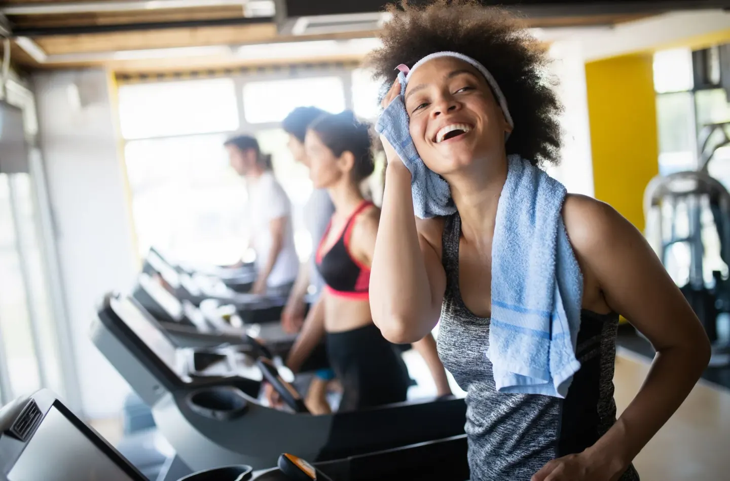 Guests exercise on treadmills in the fitness center at Hyatt Regency Grand Reserve Puerto Rico.