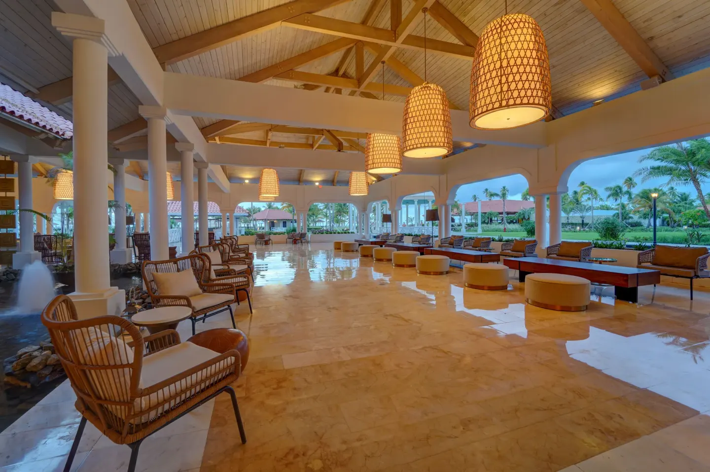 Open-air lobby lounge with wicker seating at Hyatt Regency Grand Reserve Puerto Rico.