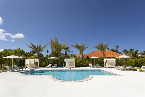 A quiet pool deck with cabanas and lounge chairs at Hyatt Regency Grand Reserve Puerto Rico.