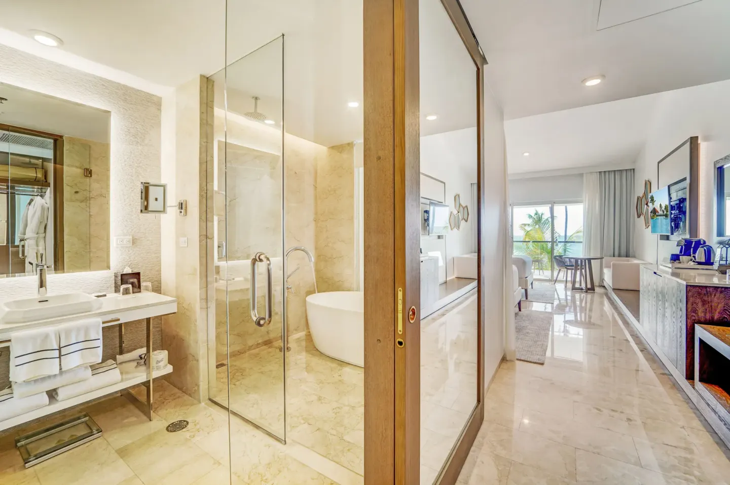 Suite bathroom and sitting area with balcony view at Hyatt Regency Grand Reserve Puerto Rico.