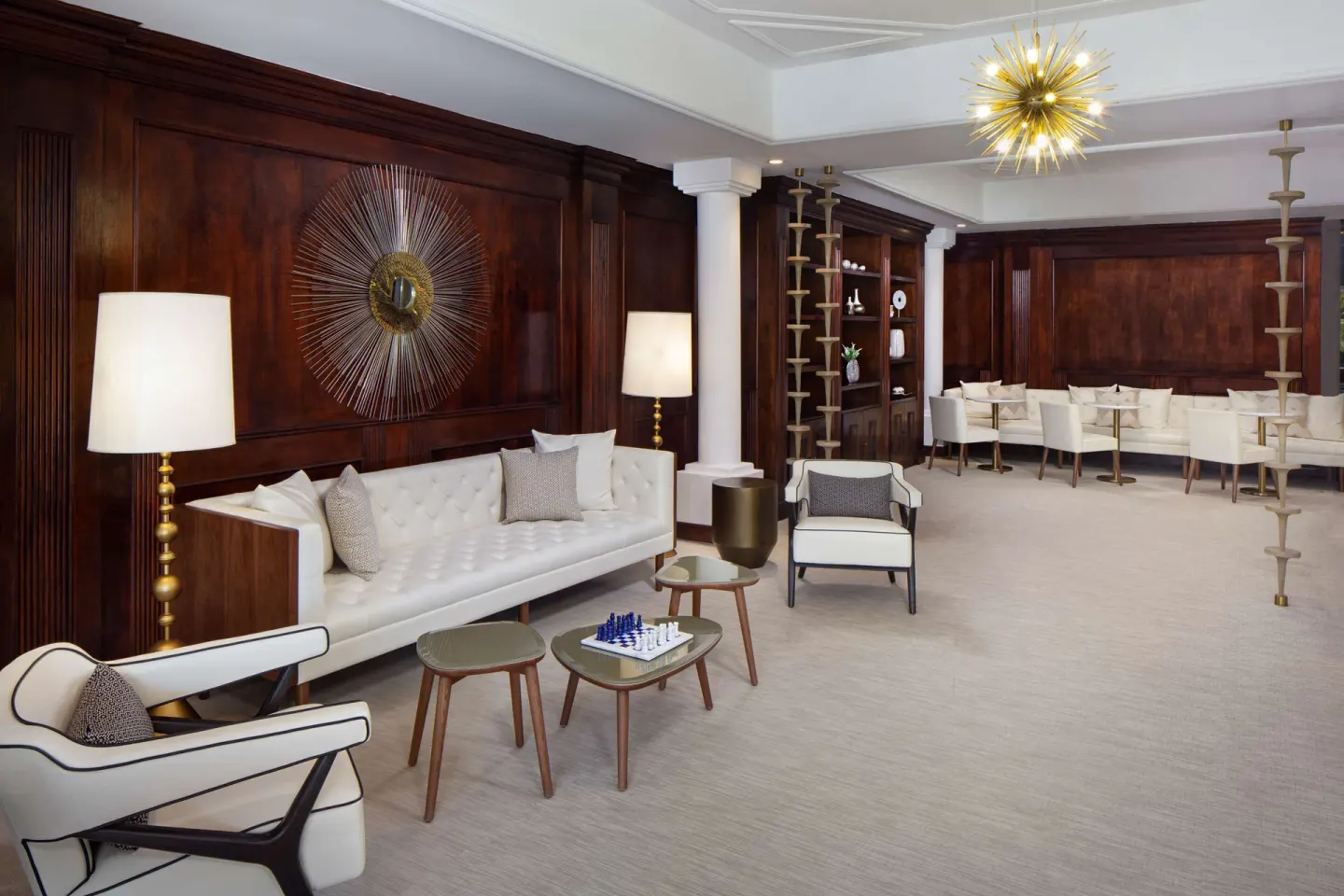 Lounge with white sofas, wood paneling and chess table at Hyatt Regency Grand Reserve Puerto Rico.