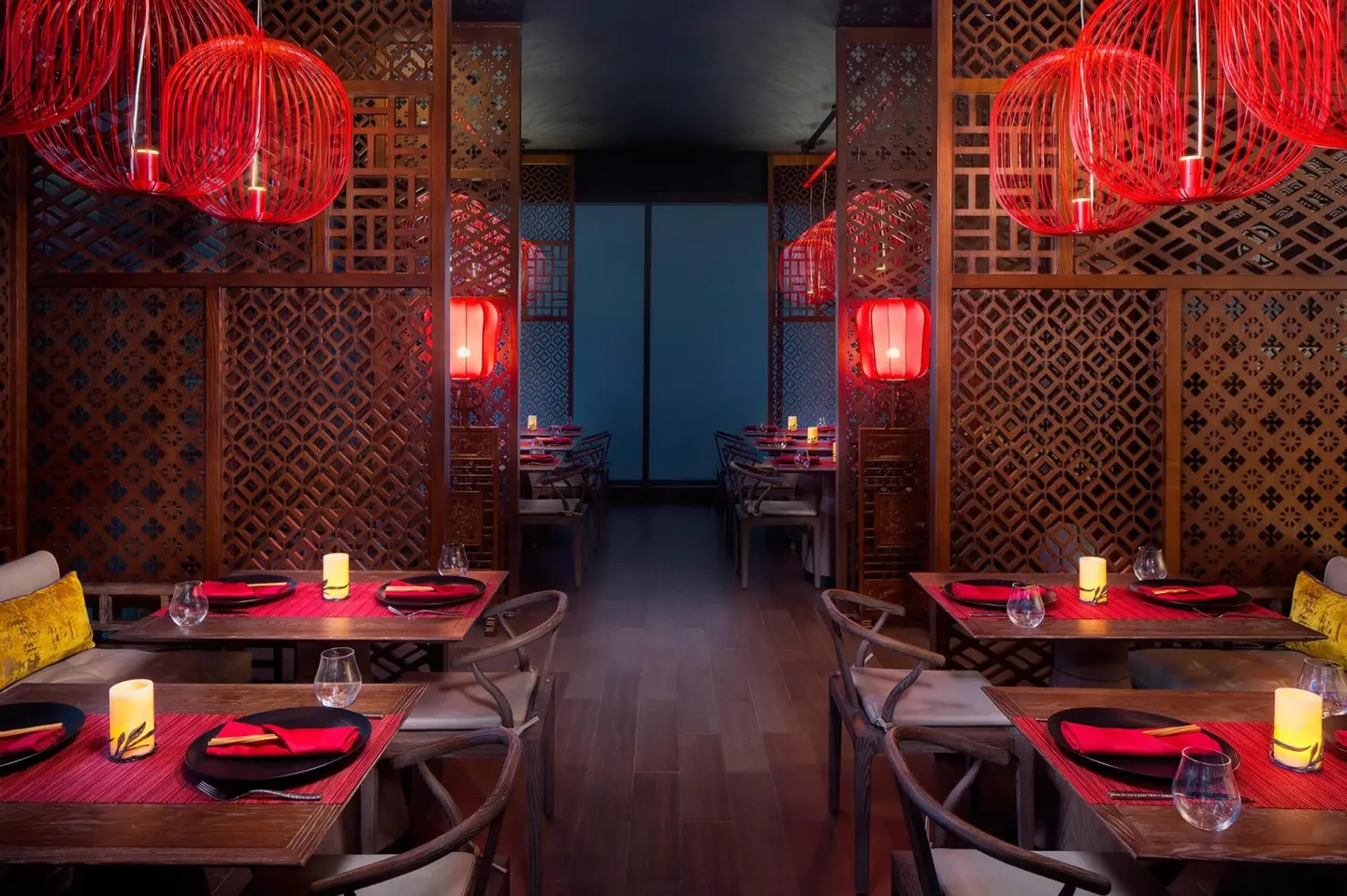 Red lantern dining room with wood lattice panels at Hyatt Regency Grand Reserve Puerto Rico.