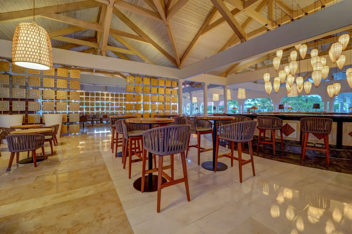 Open lobby bar seating beneath wood beams at Hyatt Regency Grand Reserve Puerto Rico.