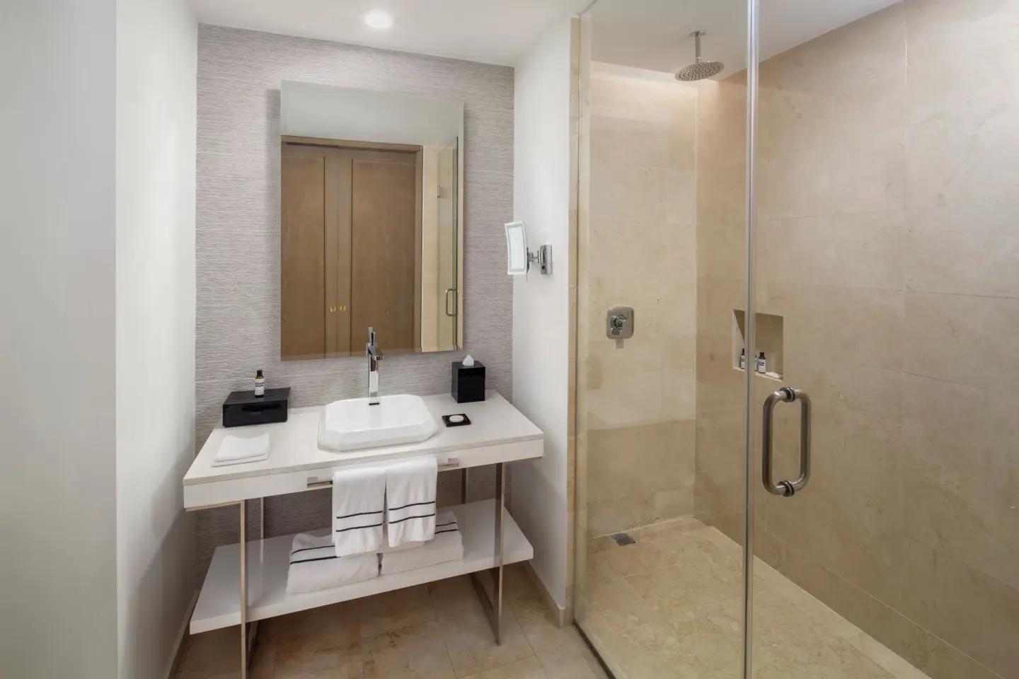 Deluxe Garden View room bathroom with vanity and glass shower at Hyatt Regency Grand Reserve Puerto Rico.