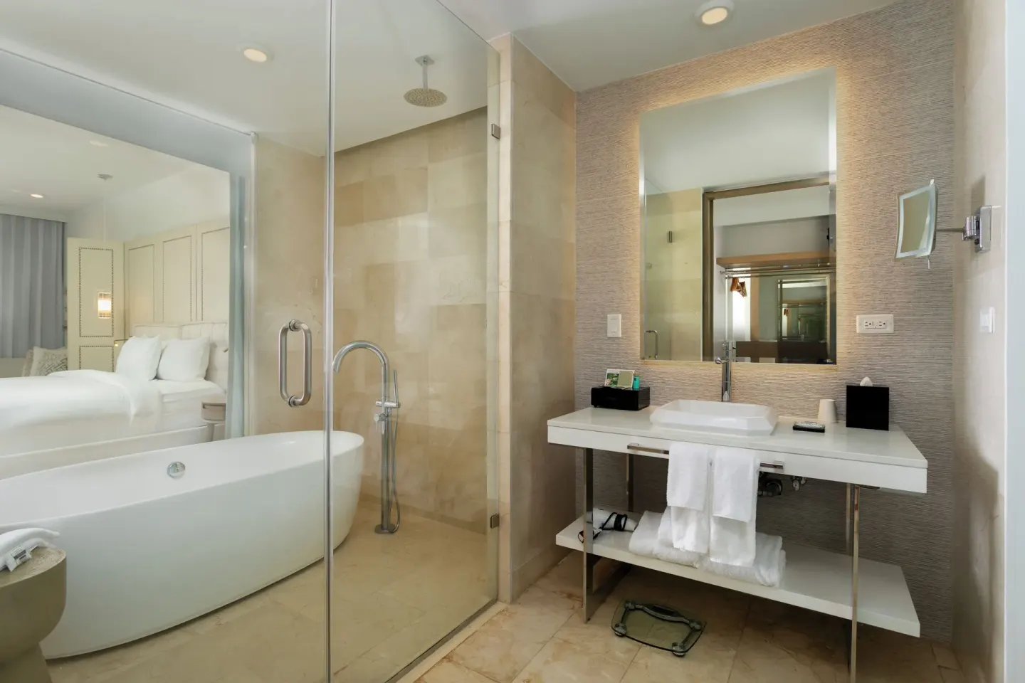 Deluxe Oceanfront bathroom with tub, glass shower and vanity at Hyatt Regency Grand Reserve Puerto Rico.