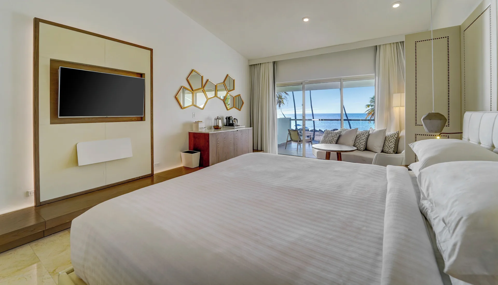 Oceanfront deluxe room with king bed and balcony at Hyatt Regency Grand Reserve Puerto Rico.