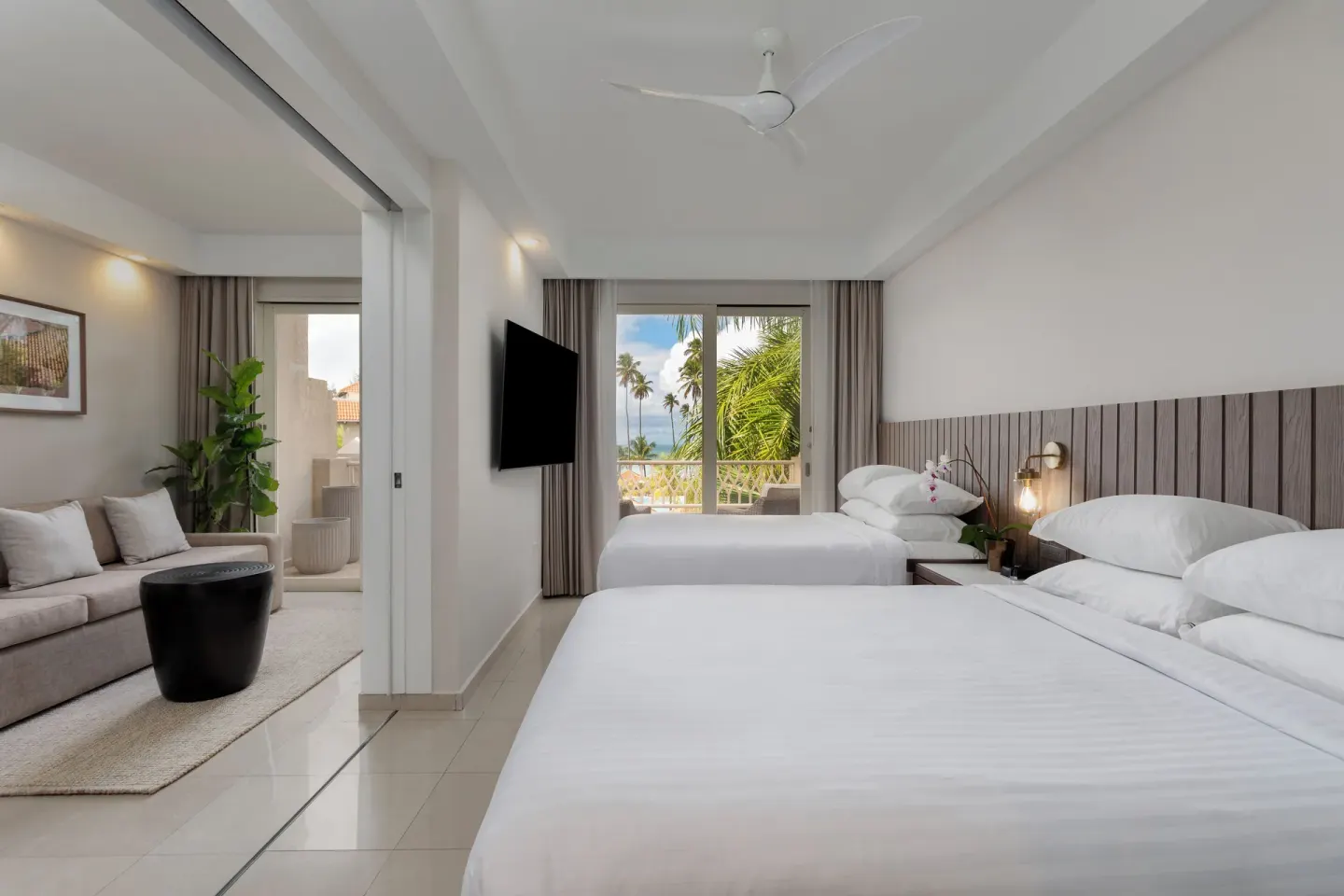 Deluxe Villa Ocean View room with two beds and sitting area at Hyatt Regency Grand Reserve Puerto Rico.