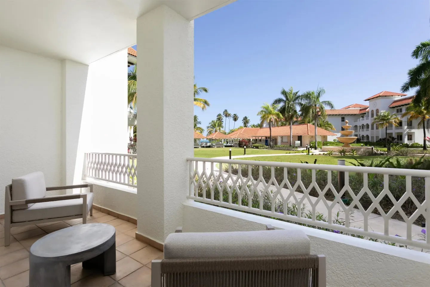 Deluxe Villa patio with seating and garden view at Hyatt Regency Grand Reserve Puerto Rico.
