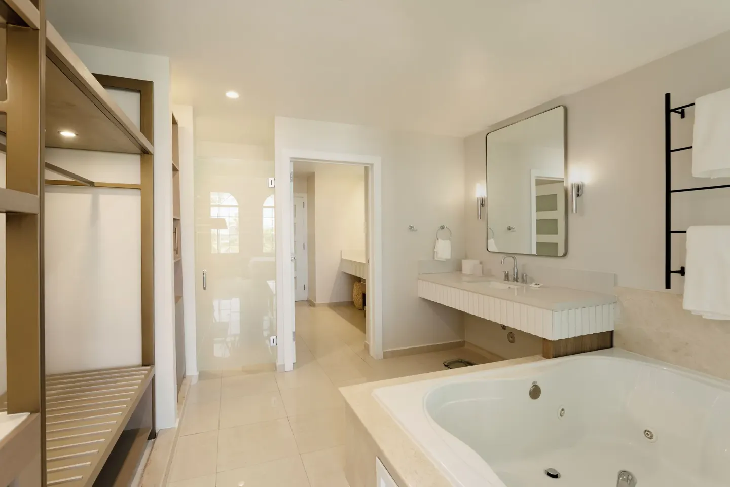 Premier Villa bathroom with soaking tub and open wardrobe at Hyatt Regency Grand Reserve Puerto Rico.