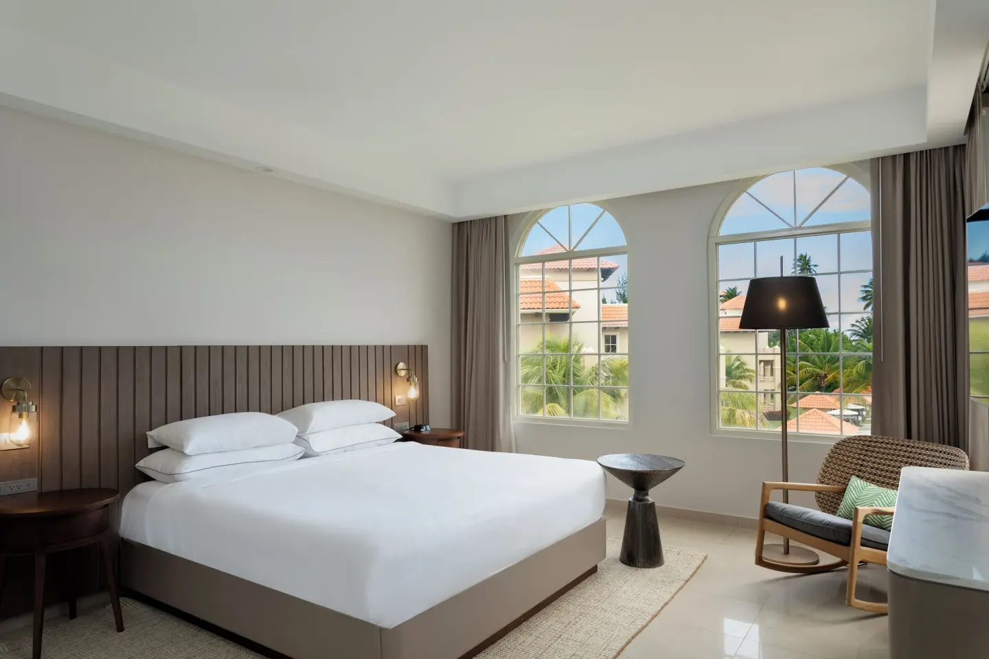 Premier Villa king bedroom with arched windows at Hyatt Regency Grand Reserve Puerto Rico.