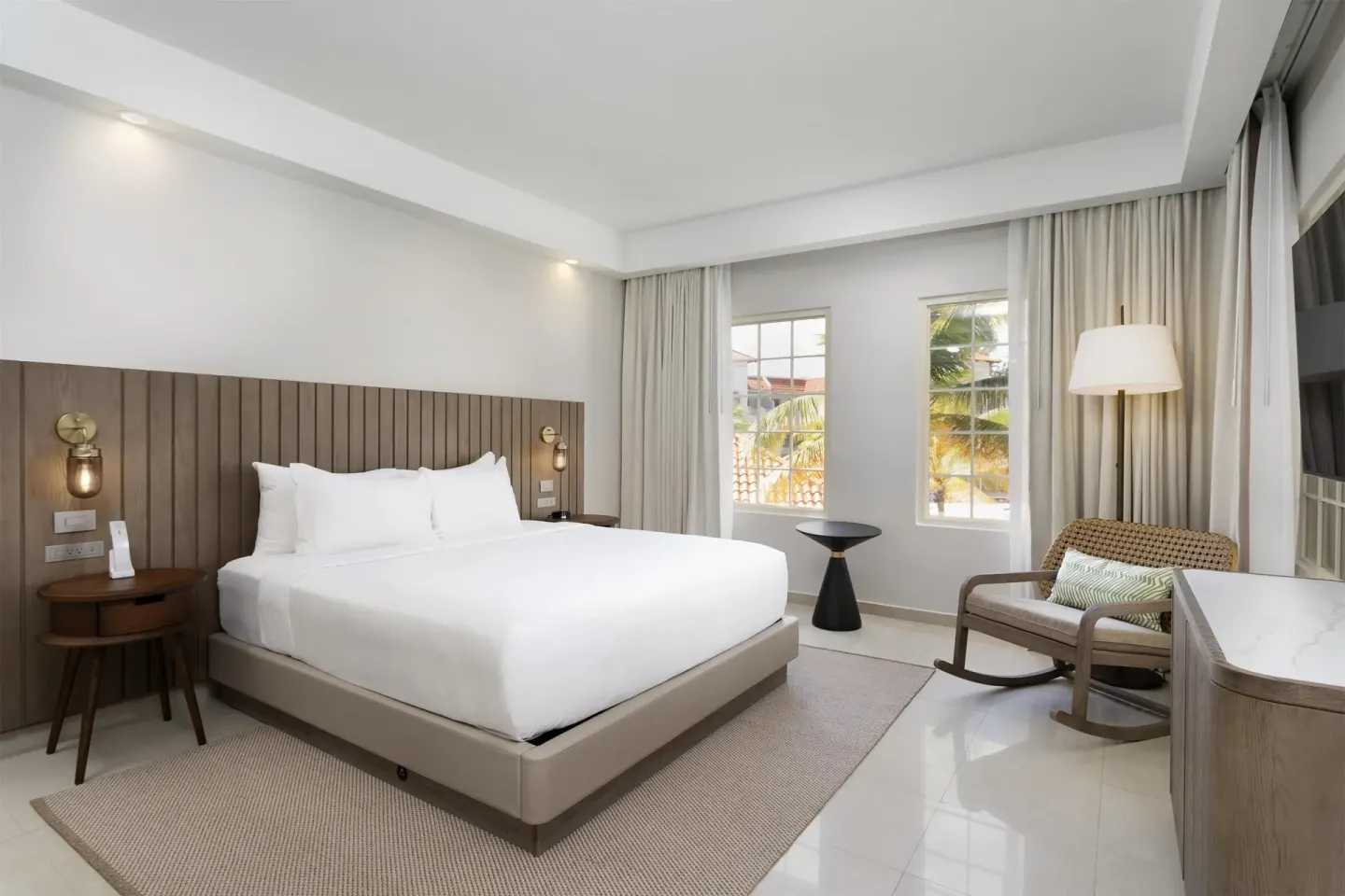 Premier Villa bedroom with king bed and seating at Hyatt Regency Grand Reserve Puerto Rico.