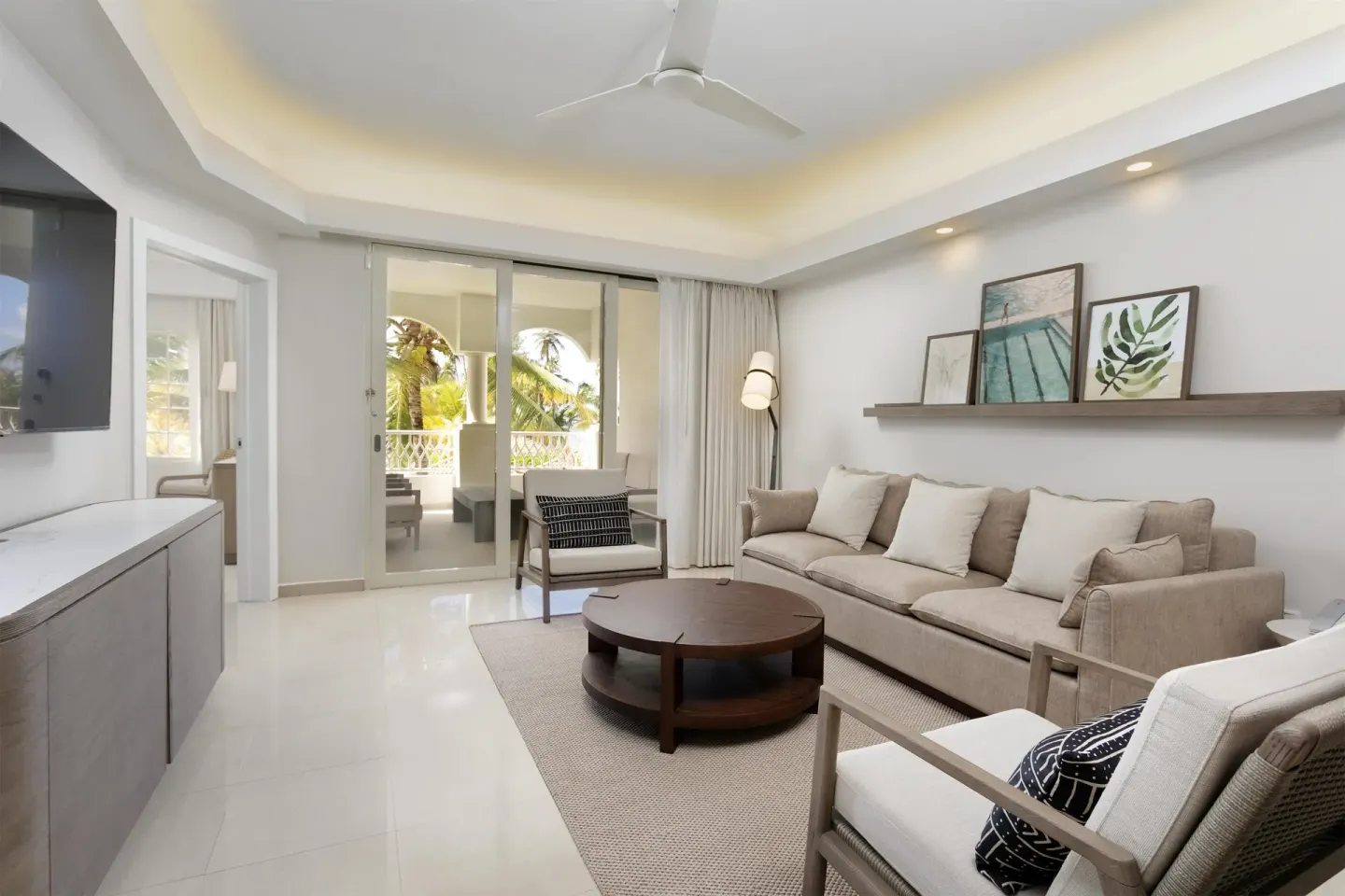Premier Villa living room with sofa and balcony at Hyatt Regency Grand Reserve Puerto Rico.