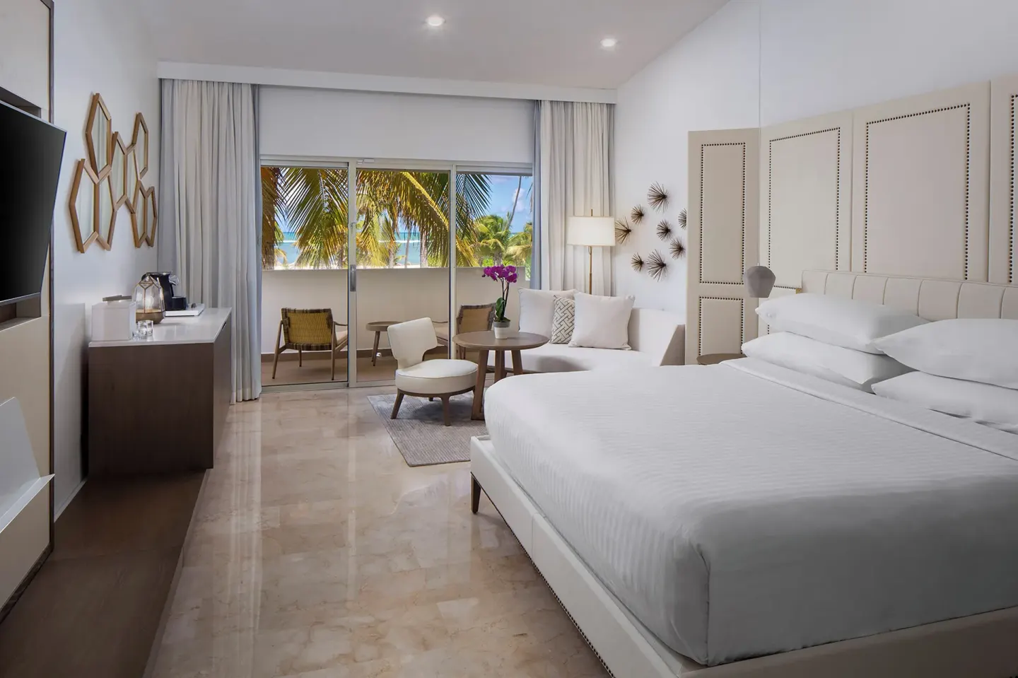 Premium Garden View king room with balcony and palms at Hyatt Regency Grand Reserve Puerto Rico.