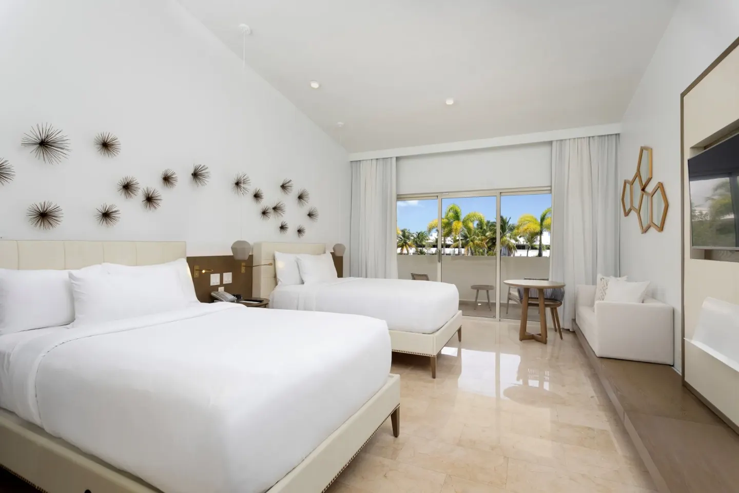 Premium Garden View room with two beds and balcony seating at Hyatt Regency Grand Reserve Puerto Rico.