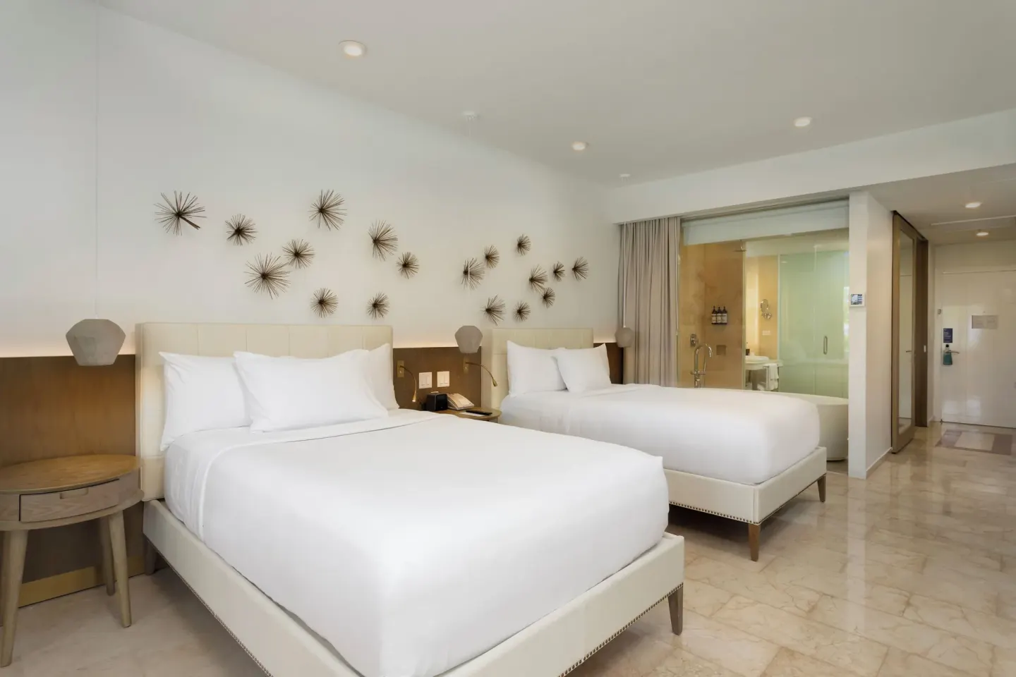 Premium Garden View room with two beds and glass bath area at Hyatt Regency Grand Reserve Puerto Rico.