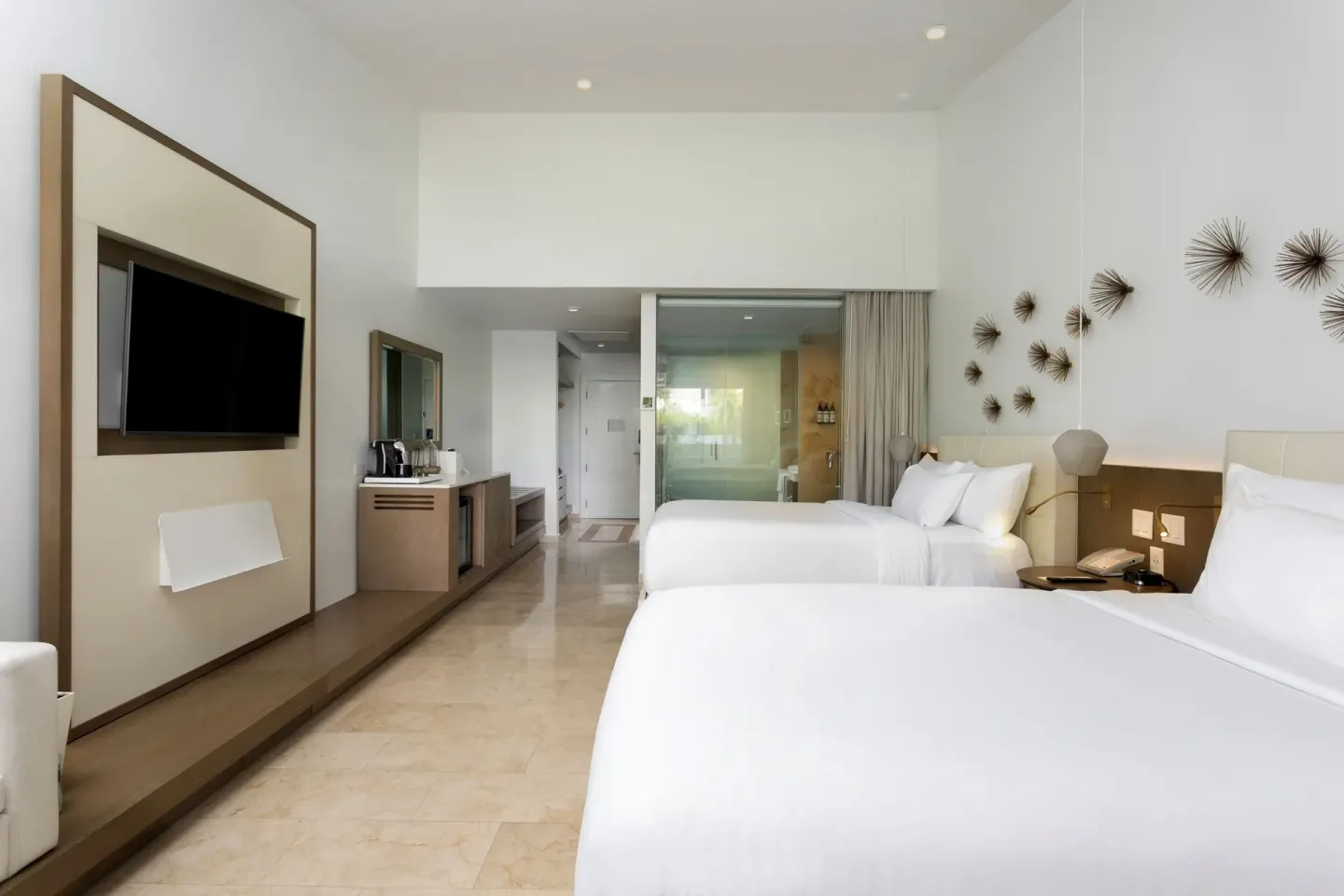 Premium Garden View room with two beds and media wall at Hyatt Regency Grand Reserve Puerto Rico.