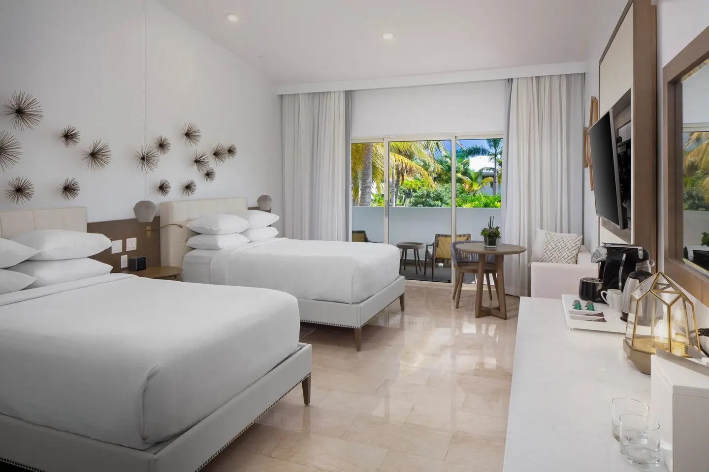 Accessible room with two beds, balcony doors and seating at Hyatt Regency Grand Reserve Puerto Rico.