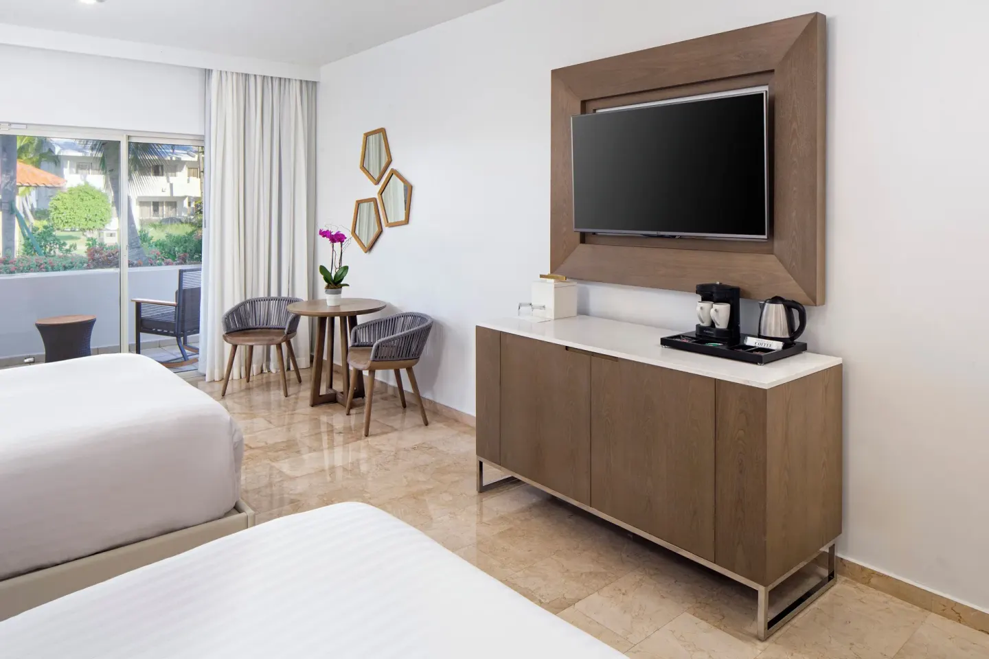 Accessible room with two beds, TV console and balcony at Hyatt Regency Grand Reserve Puerto Rico.