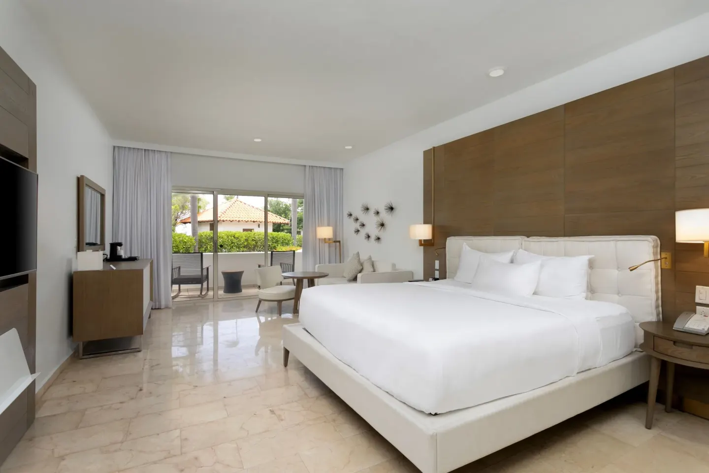 Garden View Room with king bed and sitting area at Hyatt Regency Grand Reserve Puerto Rico.