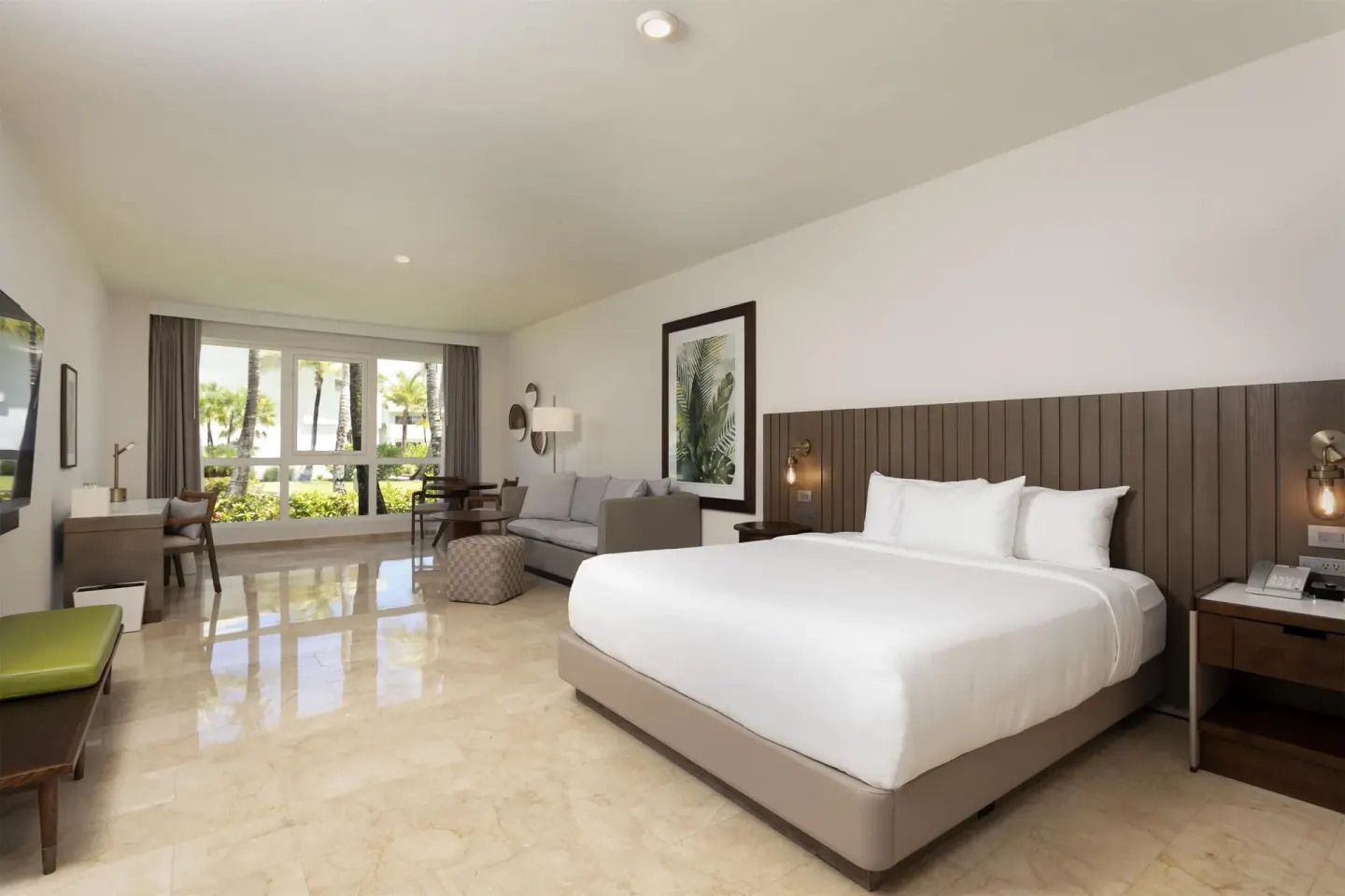 Spacious king guest room with garden-facing windows at Hyatt Regency Grand Reserve Puerto Rico.