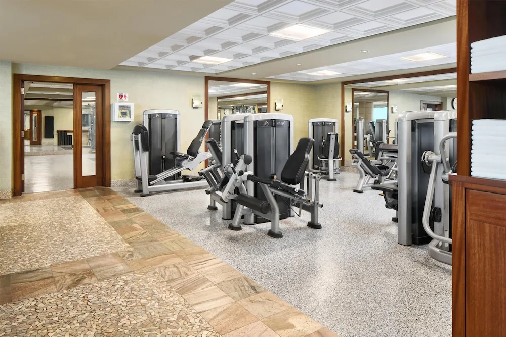 Fitness center weight machines and towel shelving at Hyatt Regency Maui Resort & Spa.