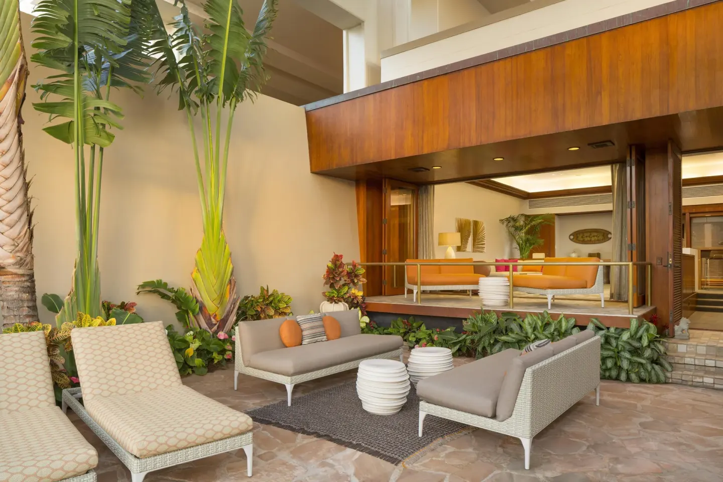 Private patio with loungers and suite interior at Hyatt Regency Maui Resort & Spa.