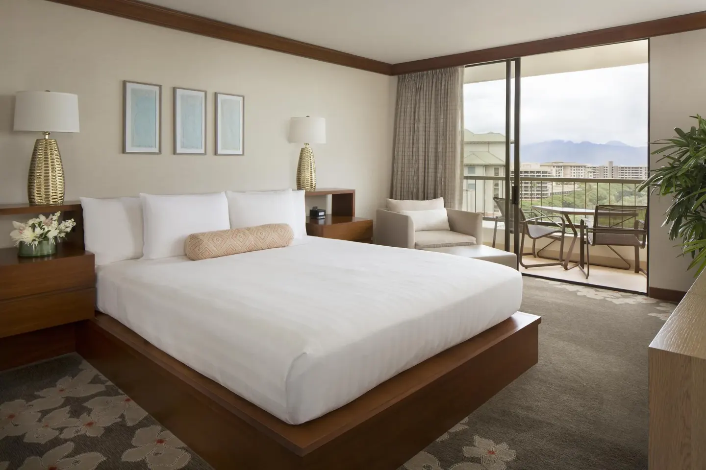 King bed guest room with balcony and mountain view at Hyatt Regency Maui Resort & Spa.