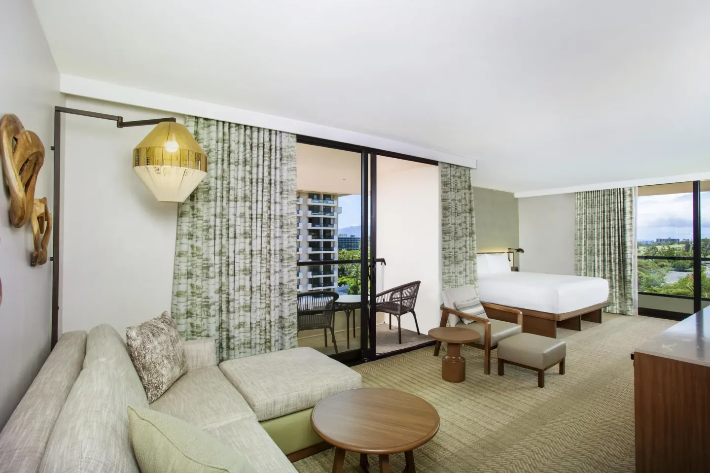King guest room with sofa lounge and balcony seating at Hyatt Regency Maui Resort & Spa.